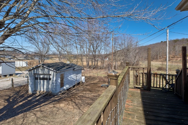 deck with an outbuilding and a storage unit