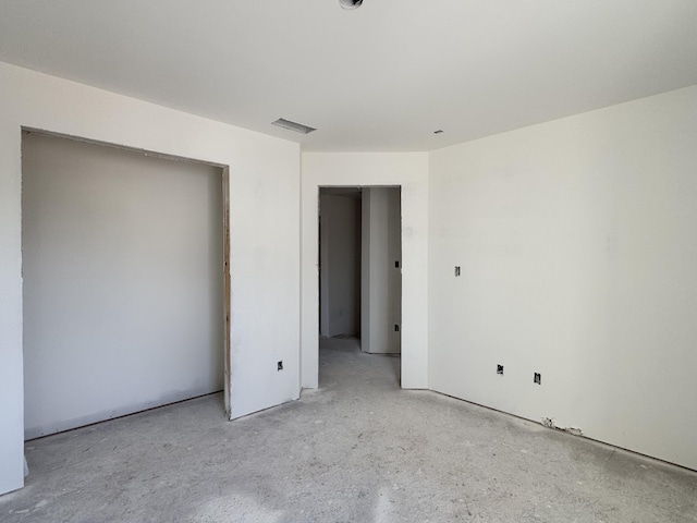 unfurnished bedroom featuring visible vents