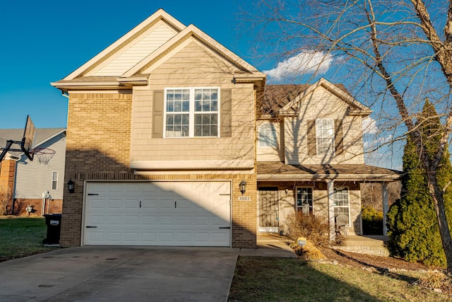 view of front of house with a garage, concrete driveway, and brick siding