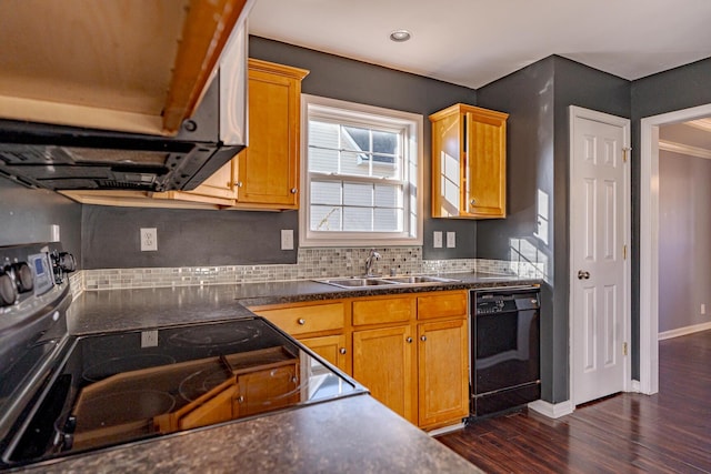 kitchen featuring black dishwasher, decorative backsplash, dark wood-style flooring, a sink, and range with electric stovetop