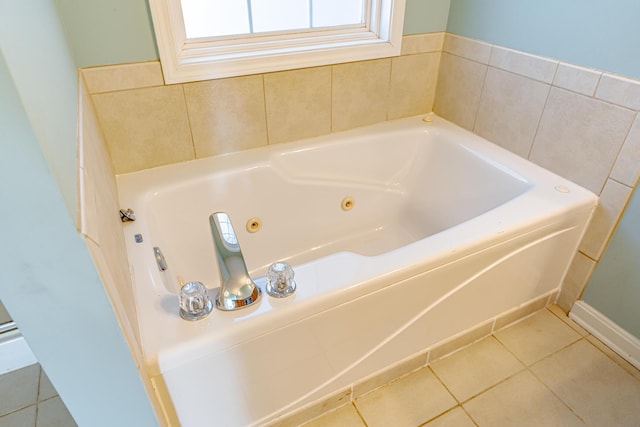 full bath featuring a tub with jets and tile patterned flooring