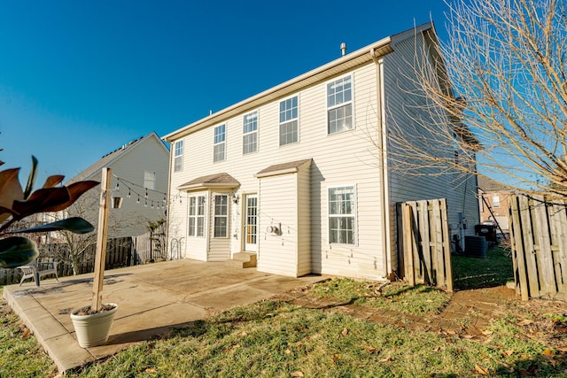 back of house featuring a patio area and fence