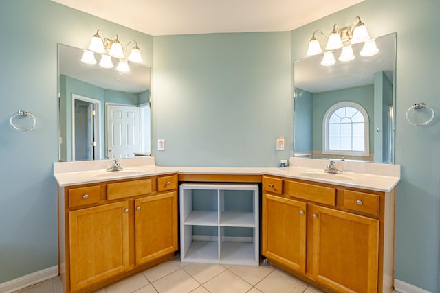 bathroom featuring tile patterned flooring, vanity, and baseboards