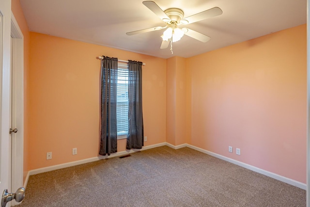 unfurnished room featuring baseboards, ceiling fan, visible vents, and carpet flooring