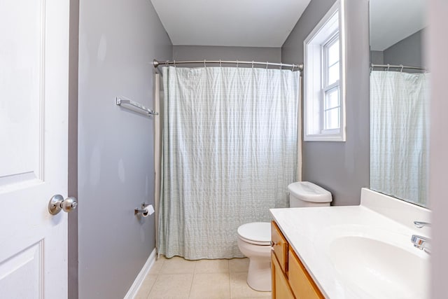 full bathroom with curtained shower, vanity, toilet, and tile patterned floors