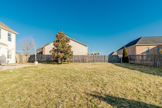 view of yard with a fenced backyard