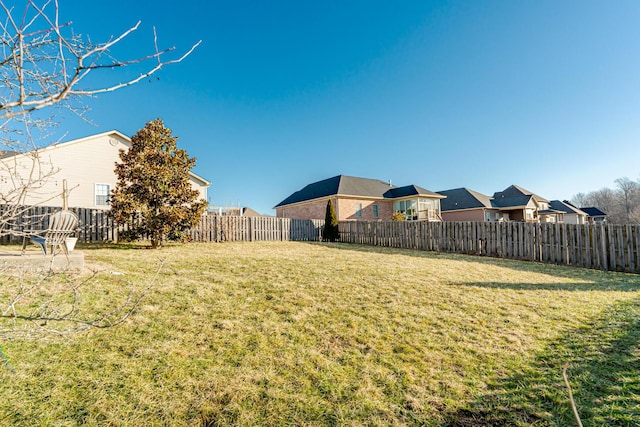 view of yard with a fenced backyard