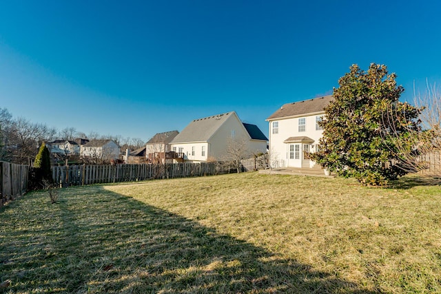 view of yard featuring a patio area and a fenced backyard