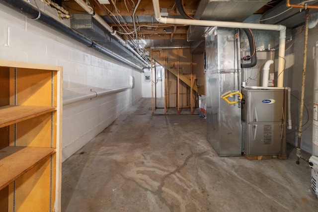 unfinished below grade area featuring heating unit