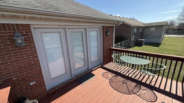 deck with cooling unit and a lawn