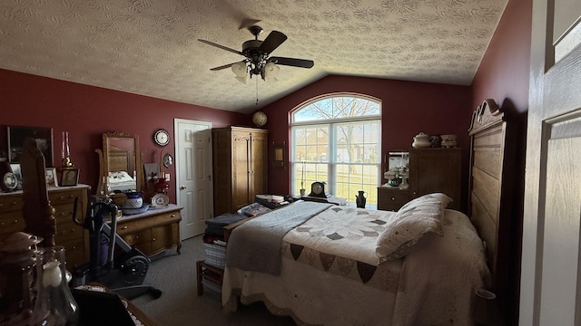 carpeted bedroom featuring ceiling fan, vaulted ceiling, and a textured ceiling