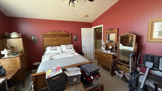 carpeted bedroom with lofted ceiling, ceiling fan, and a textured ceiling