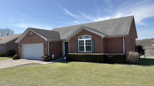 ranch-style home with an attached garage, driveway, a front lawn, and brick siding