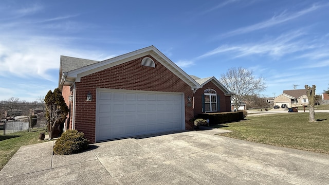 view of front of house with a garage, brick siding, concrete driveway, roof with shingles, and a front yard