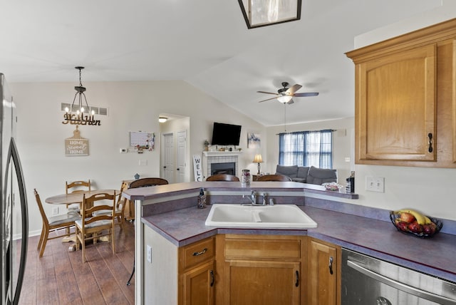 136 Country Ln, Lancaster, KY 40444 - kitchen featuring a sink, appliances with stainless steel finishes, dark countertops, a tile fireplace, and ceiling fan