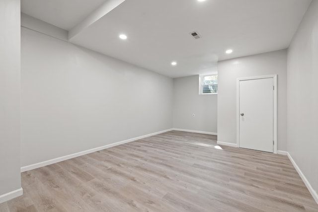 spare room with visible vents, recessed lighting, baseboards, and light wood-style floors