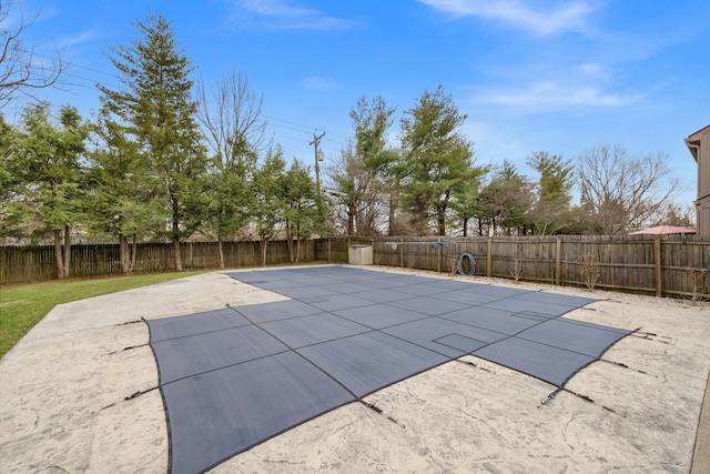 view of swimming pool featuring a patio and a fenced backyard