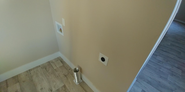 laundry room with hookup for a washing machine, light wood-style flooring, hookup for an electric dryer, laundry area, and baseboards