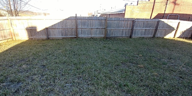 view of yard featuring a fenced backyard