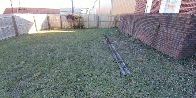 view of yard featuring a fenced backyard