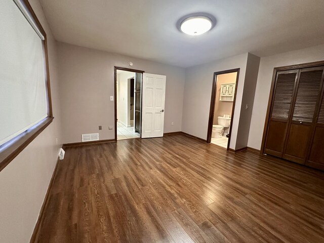 hall featuring light tile patterned floors and baseboards