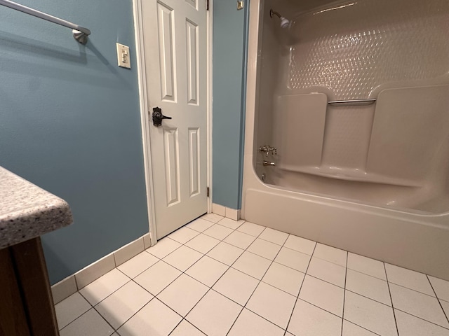 full bathroom featuring baseboards, bathtub / shower combination, and tile patterned floors