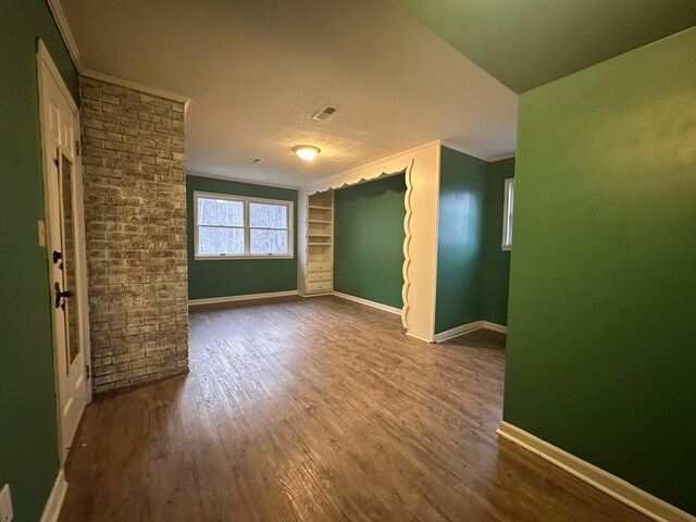 hallway featuring dark wood finished floors and baseboards