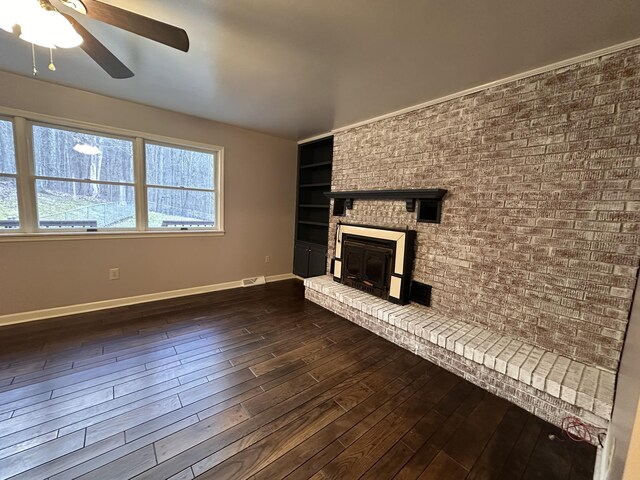 unfurnished room with dark wood-style floors, ceiling fan, and baseboards