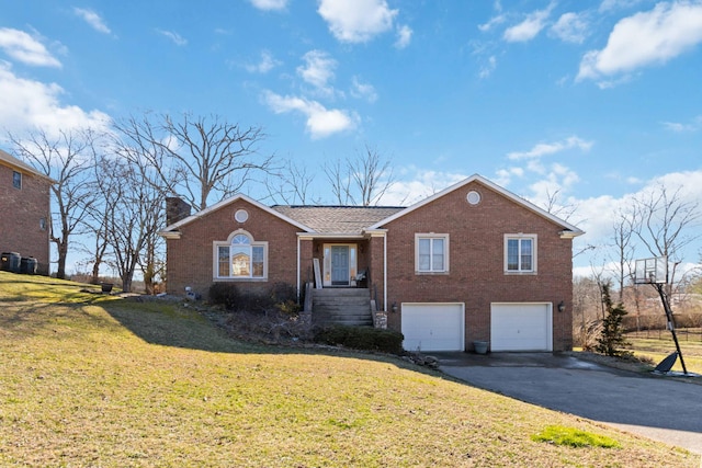 ranch-style house with aphalt driveway, a garage, brick siding, a chimney, and a front yard