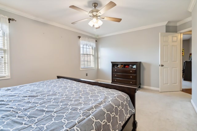 bedroom with baseboards, carpet flooring, a ceiling fan, and crown molding