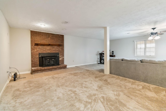 unfurnished living room featuring ceiling fan, a textured ceiling, baseboards, and carpet flooring