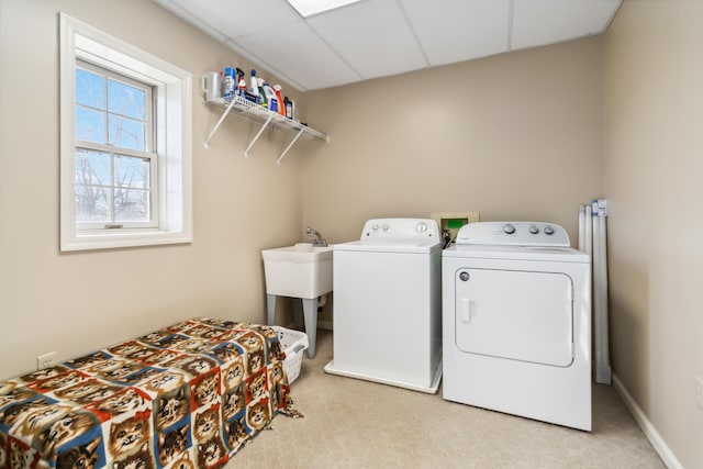 laundry room featuring laundry area, baseboards, and independent washer and dryer