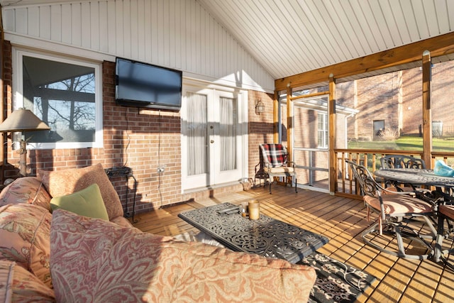 sunroom / solarium with vaulted ceiling