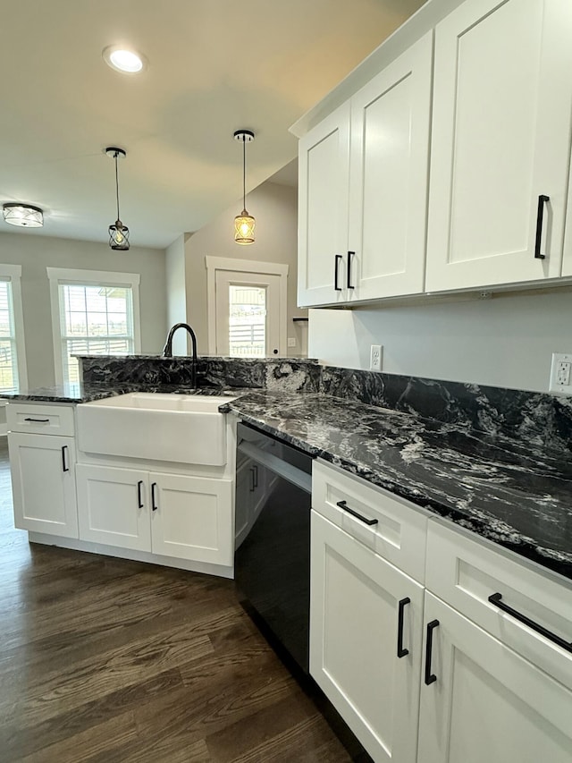 kitchen with a sink, white cabinets, dark wood-type flooring, and dishwasher