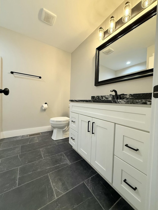 bathroom featuring baseboards, visible vents, toilet, marble finish floor, and vanity