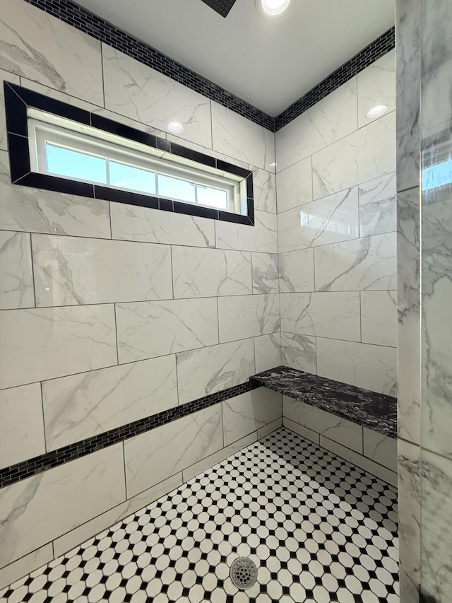 full bathroom featuring a tile shower