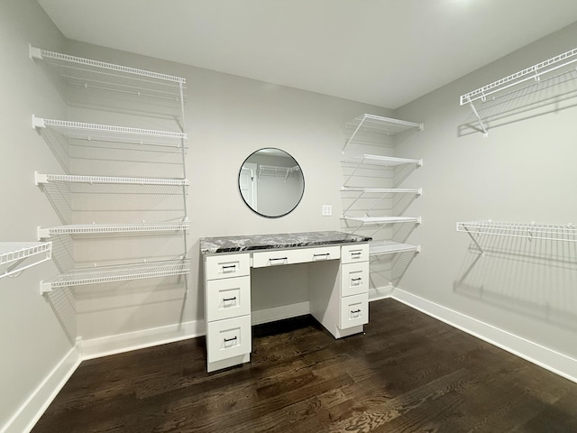 walk in closet featuring dark wood-style flooring