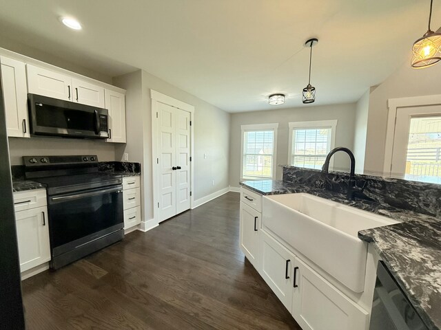 kitchen with white cabinets, dishwasher, dark wood finished floors, black electric range, and a sink