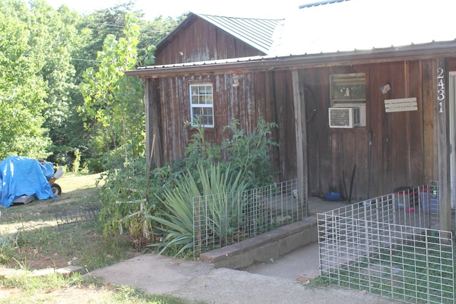 view of outbuilding featuring cooling unit