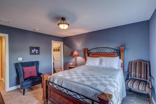 bedroom featuring baseboards, visible vents, and carpet flooring