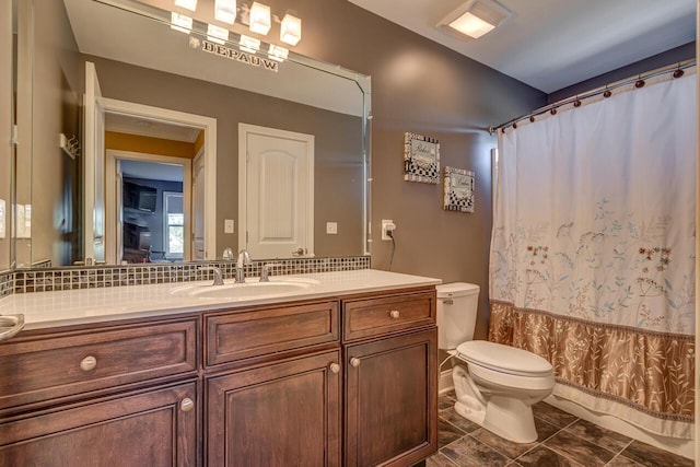 full bath featuring toilet, curtained shower, decorative backsplash, and vanity