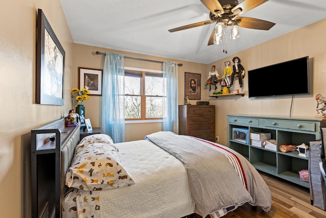 bedroom featuring ceiling fan and wood finished floors