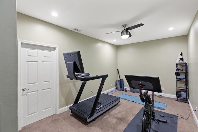 exercise room featuring carpet, visible vents, ceiling fan, and baseboards