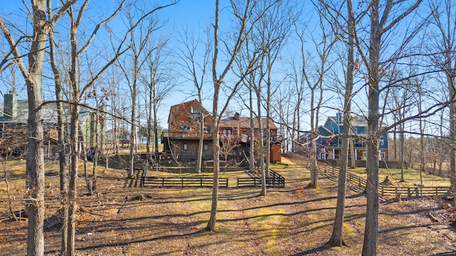 exterior space with fence and a yard