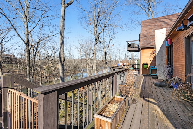 deck featuring a water view