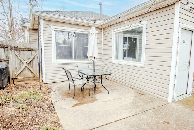 view of patio / terrace featuring fence