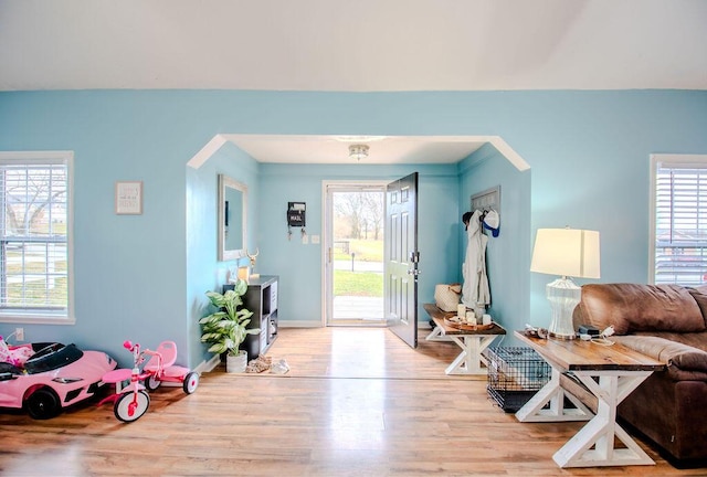 interior space featuring baseboards and wood finished floors