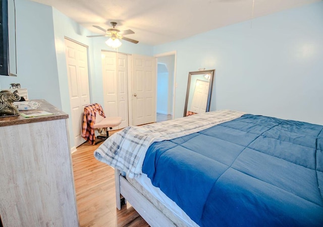 bedroom featuring a ceiling fan and light wood-type flooring