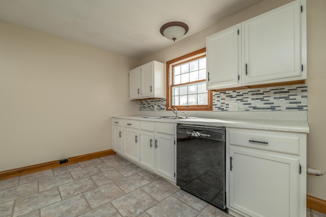 kitchen with black dishwasher, baseboards, decorative backsplash, white cabinetry, and a sink