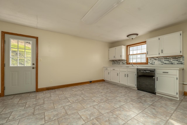 kitchen with tasteful backsplash, baseboards, dishwasher, light countertops, and white cabinetry